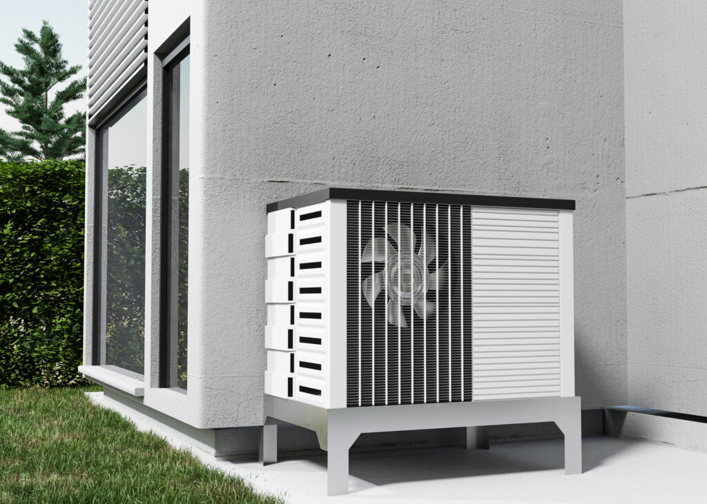 Air source heat pump outdoor unit beside a modern home