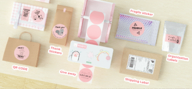 Various Munbyn thermal labels including QR codes, thank you stickers, fragile stickers, organization labels, and shipping labels displayed on a desk.