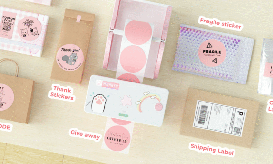 Various Munbyn thermal labels including QR codes, thank you stickers, fragile stickers, organization labels, and shipping labels displayed on a desk.